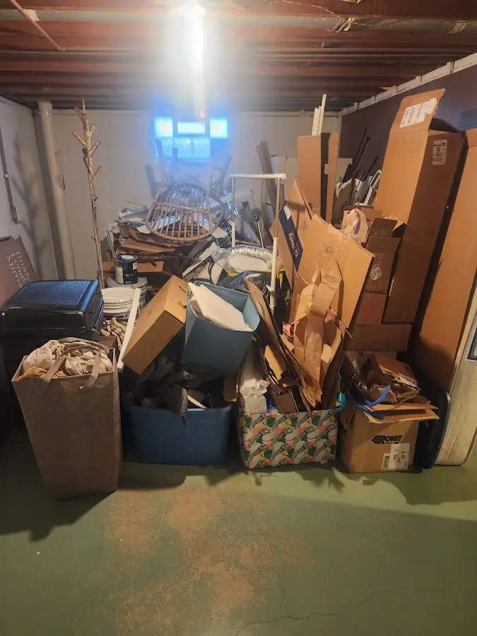 Roll-off dumpster container at job site for 15 Yard Dumpster Rental in Lawrence